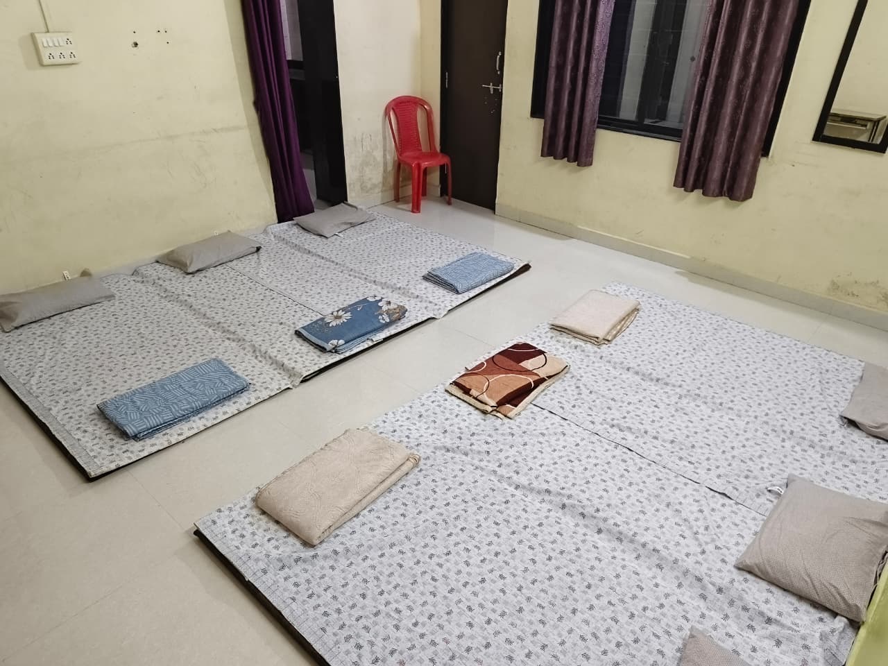 Group pilgrim room with neatly arranged bedding